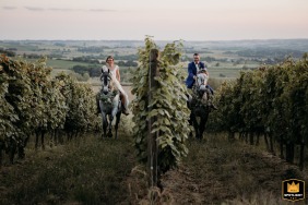 In the vineyards at the couple's home in Lot-et-Garonne, photos capture the newlyweds on horseback during their couple's session.